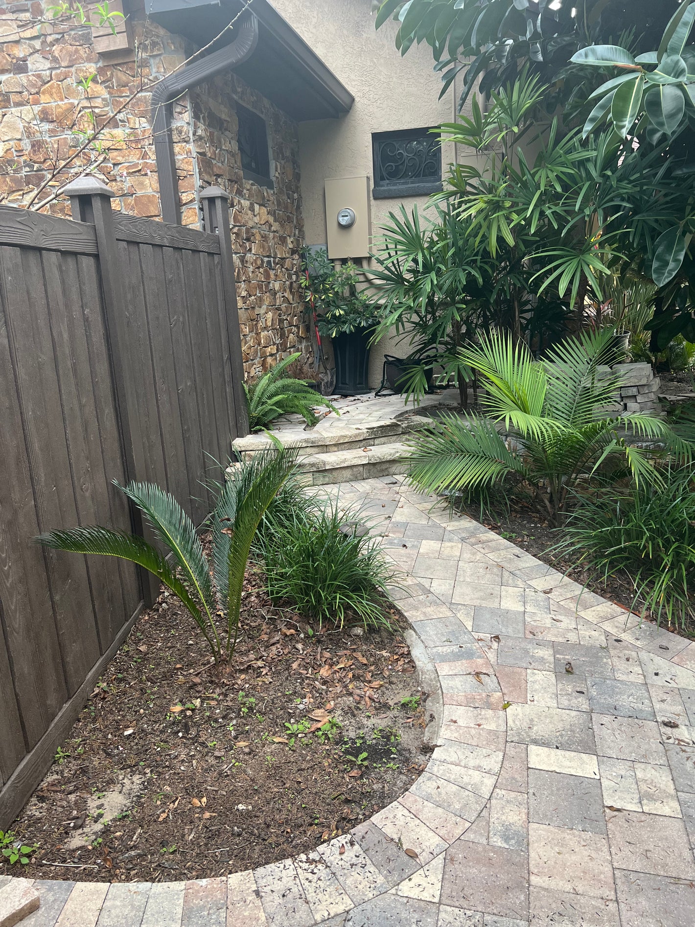 Paver walkway leading to utilities