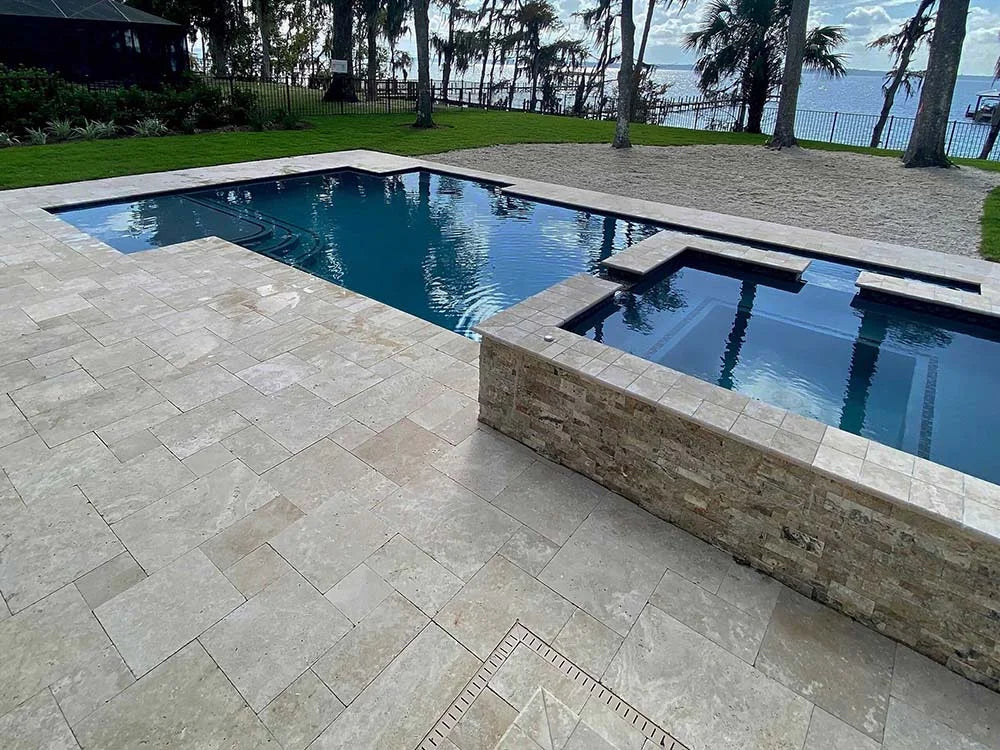 TRAVERTINE & MARBLE DECKS + PATIOS