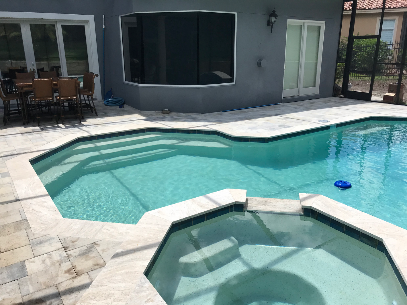 Travertine and paver pool deck, coping, and spa