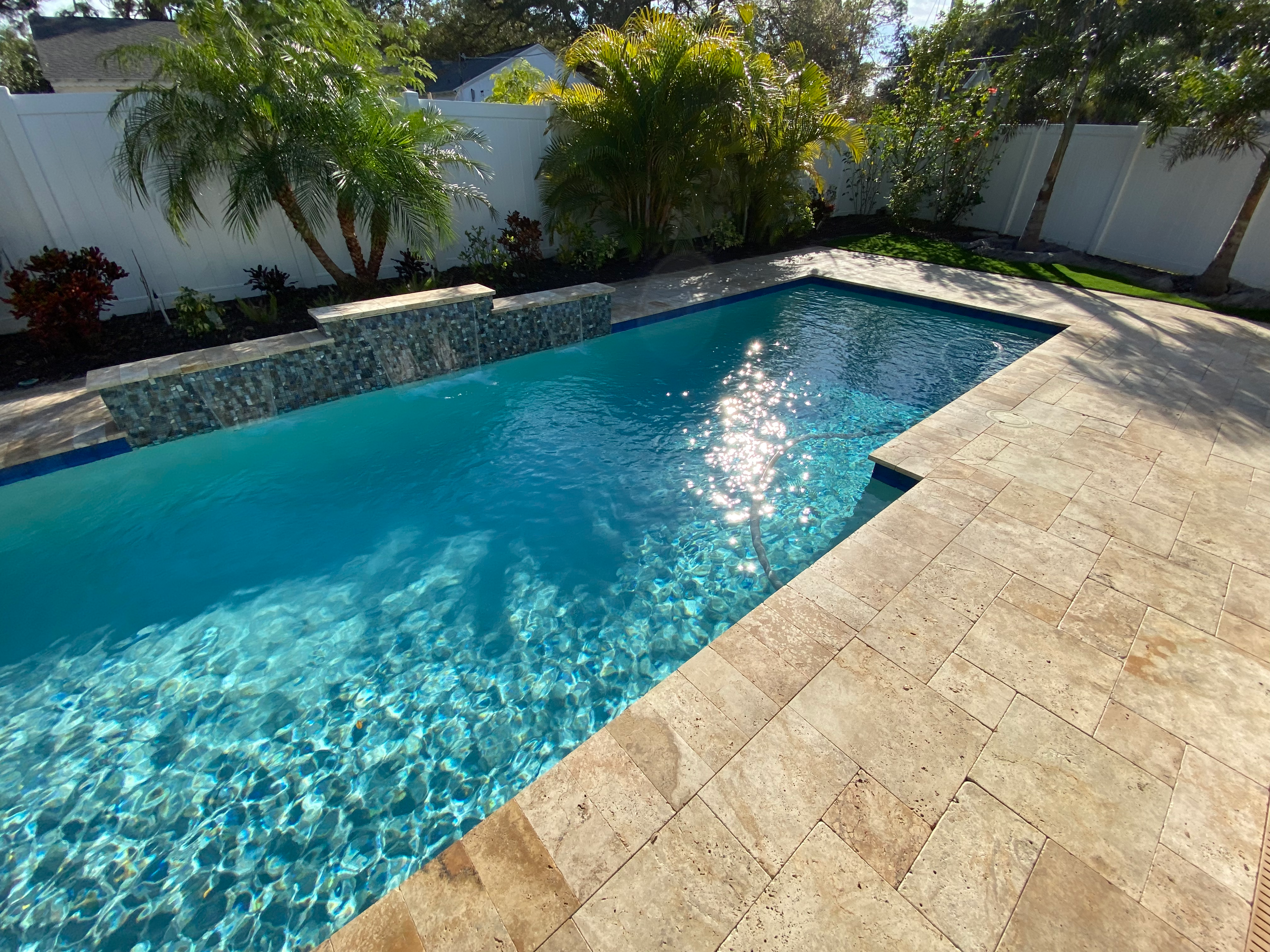 Travertine Pool Deck and Tile Waterfall